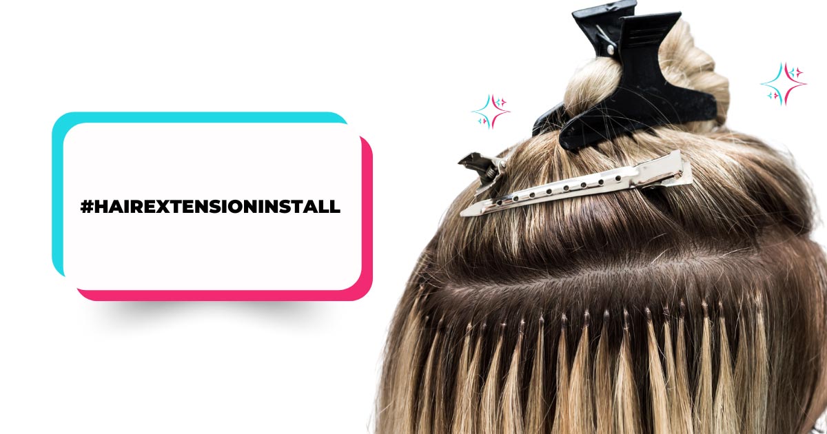 Hair extensions being applied to the back of a person's head, showing individual bonds and a hair clip.