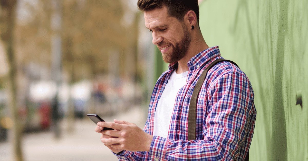 man looking at phone