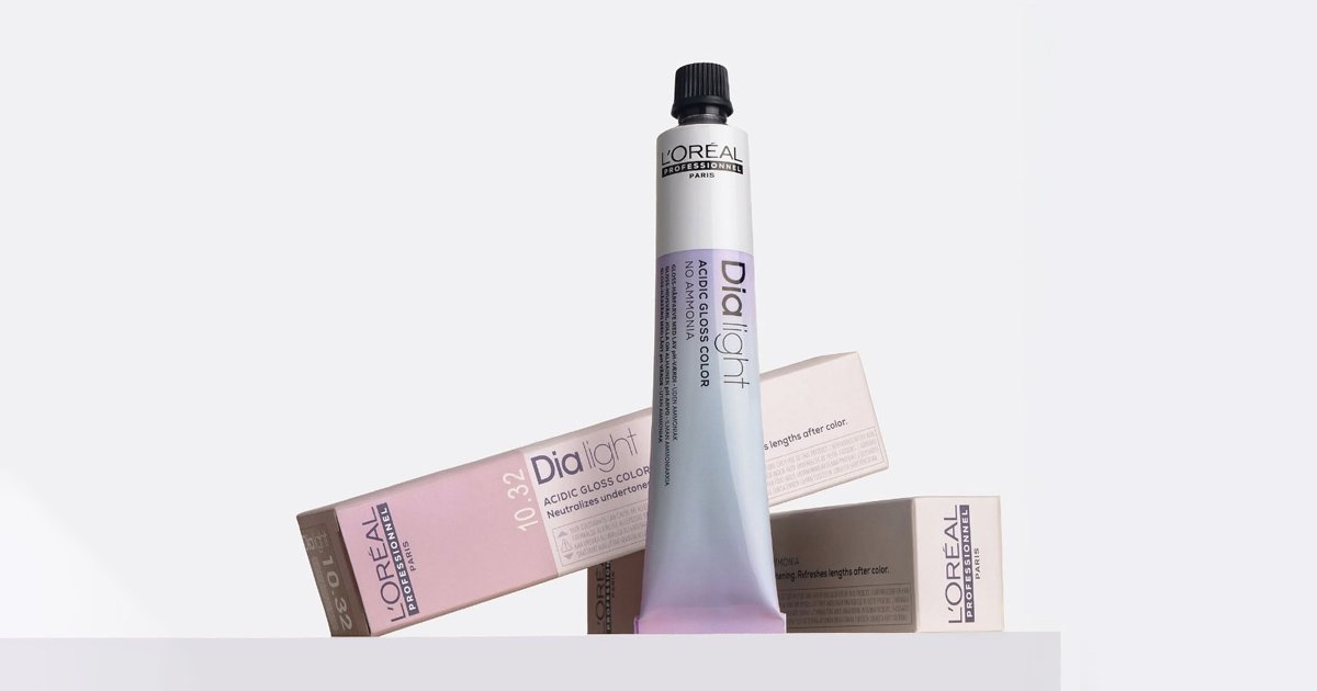 L'Oréal Professionnel Dia Light Acidic Gloss Color hair dye tube standing upright in front of its matching pink packaging boxes.